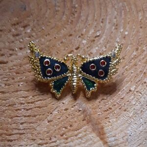 Elegant Gold Butterfly Brooch with Red and Green Accents